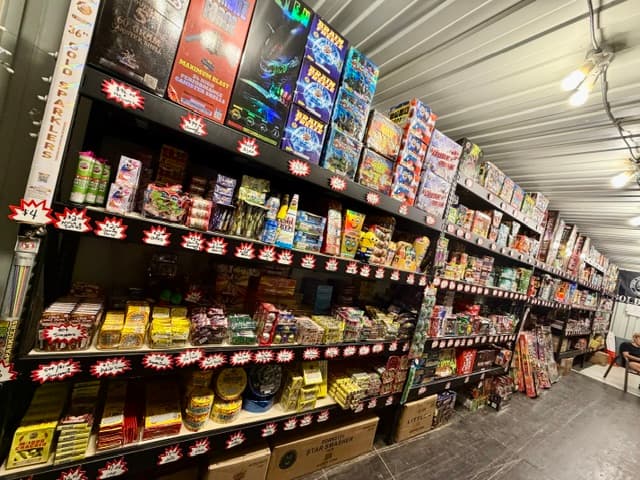 Fully stocked shelves inside a Pooter's Fireworks retail stand