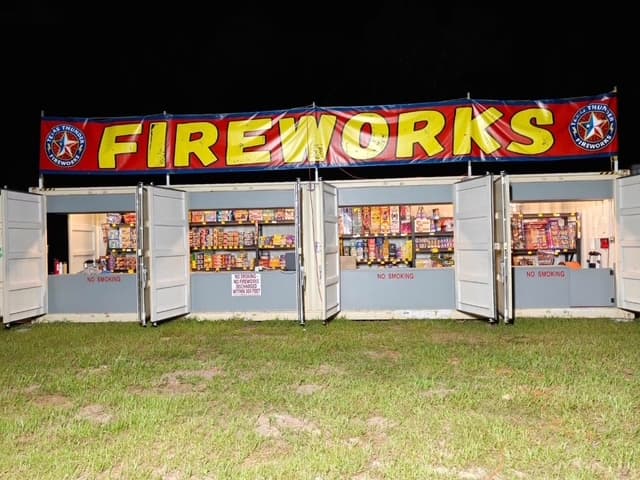 Pooter's Fireworks shipping container stand used for seasonal retail fireworks sales in Texas